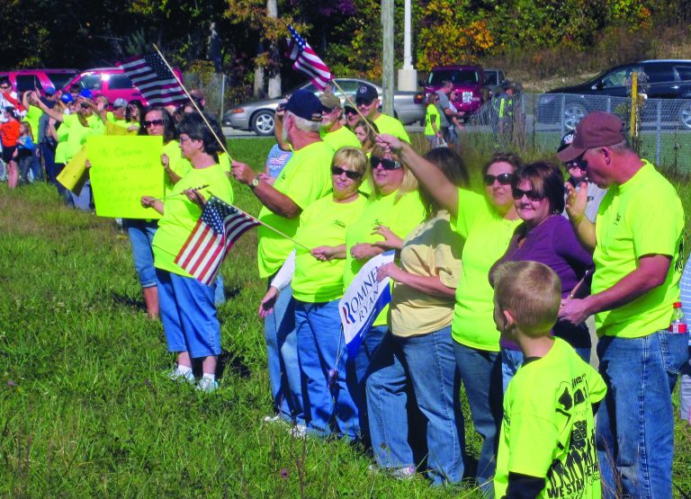 In a Saturday Oct. 13, 2012 photo, hundreds congregated along U.S. 23 from Big Stone Gap to Pound and into Kentucky in support of coal miners and the mining industry. Only a few generations ago, coal miners were literally at war with their employers, spilling and shedding blood on West Virginia's Blair Mountain in a historic battle for union representation and fair treatment. Today, their descendants are allies in a carefully choreographed rhetorical war playing out across eastern Kentucky, southwestern Virginia and all of West Virginia. It's fueled by a single, unrelenting message that they now face a common enemy, the federal government, that has decided that coal is no longer king, or even noble. (AP Photo/Bristol Herald Courier, Allie Robinson)