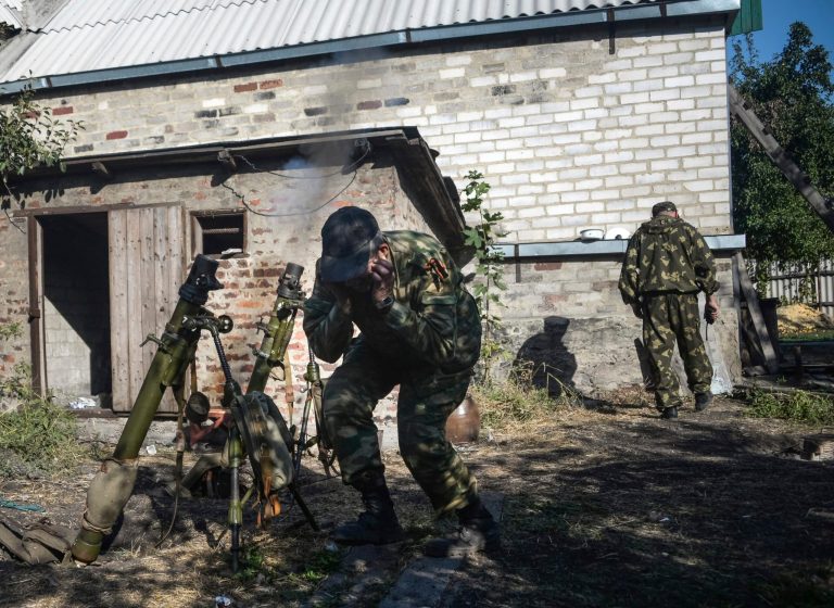 Pro-Russian rebels lead suppressive fire at the positions of Ukrainian army, during shelling in Donetsk, eastern Ukraine on Wednesday. (AP/Mstyslav Chernov)