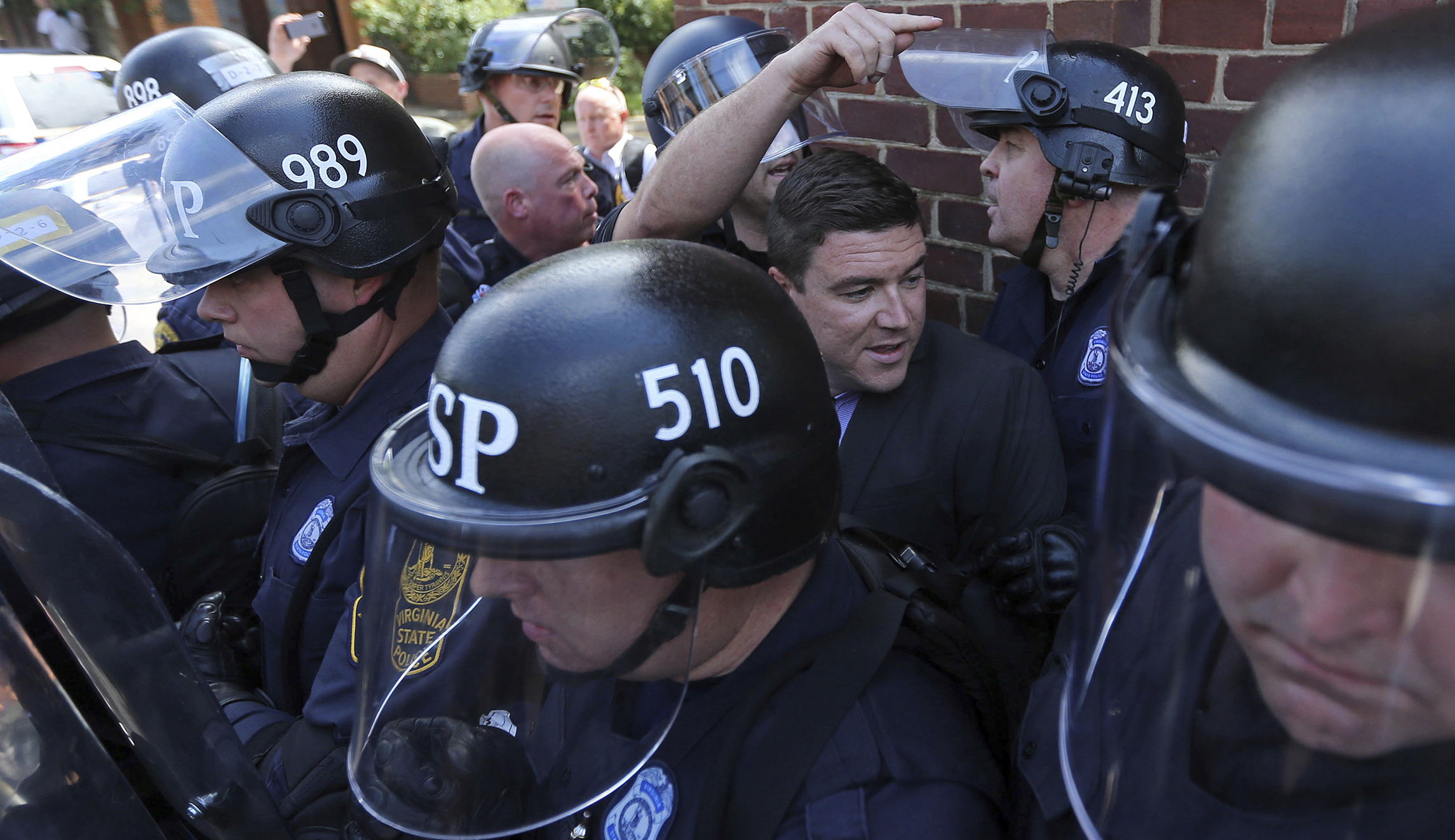 Watch: Man who organized Charlottesville white supremacist rally chased from press conference