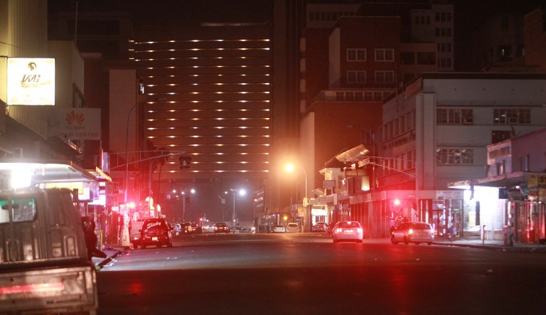 Armed soldier and military vehicles were seen in the streets of Zimbabwe's capital, Harare, and at least three explosions were heard on Wednesday morning, local time. (AP Photo/Tsvangirayi Mukwazhi)