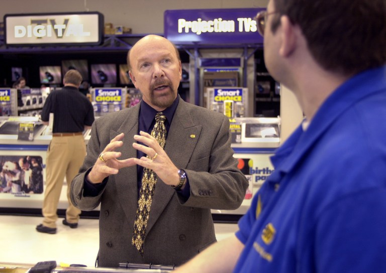   FILE- This April 7, 2000, file photo, shows Richard Schulze, the founder and CEO of Best Buy talking with Alan Hauslander who works at the Richfield Best Buy in Richmond, Minn. Schulze, the founder and outgoing chairman of Best Buy, announced his resignation from the board Thursday June 7, 2012, and said that he and may sell off his 20.1 percent stake in the beleaguered electronics retailer. (AP Photo/The Star Tribune, Richard Sennott) MANDATORY CREDIT; ST. PAUL PIONEER PRESS OUT; MAGS OUT; TWIN CITIES  