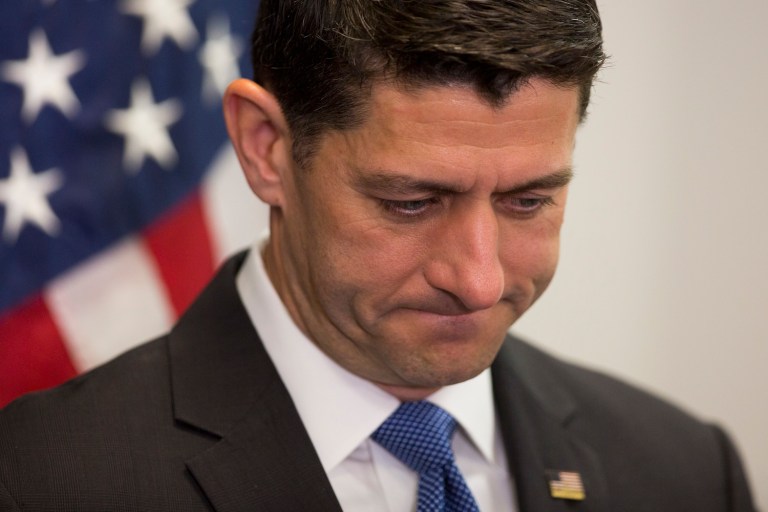 The other half of the group reportedly sat in a parking lot, refusing to partake in the photo, according to reports Sunday. (AP Photo/Evan Vucci)