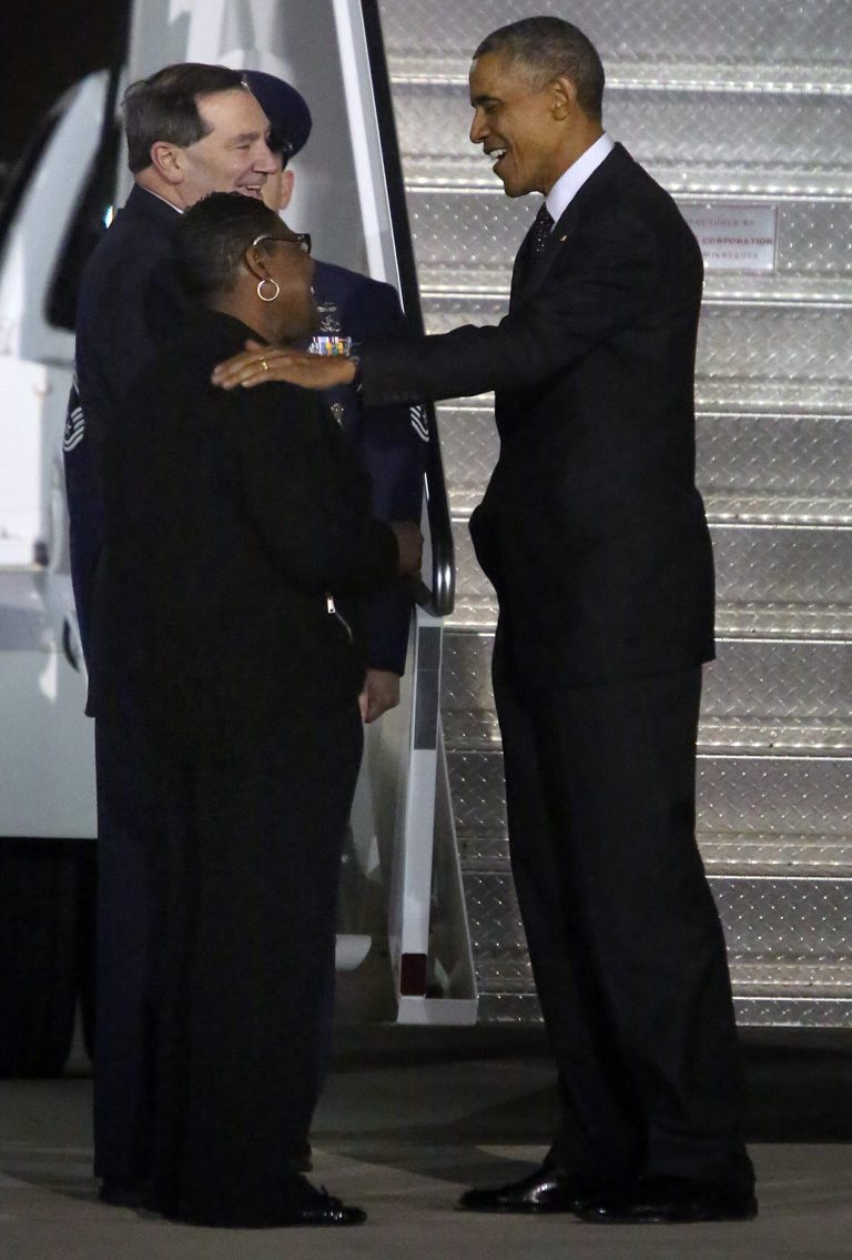 President Barack Obama, right, talks with Gary, Ind. Mayor Karen Freeman-Wilson, left, while U.S. Senator Joe Donnely looks after arriving at the Gary/Chicago International Airport in Gary, Ind., Wednesday, Oct. 1, 2014. (AP Photo/The Times, John J. Watkins) MANDATORY CREDIT; CHICAGO LOCALS OUT;  GARY OUT
