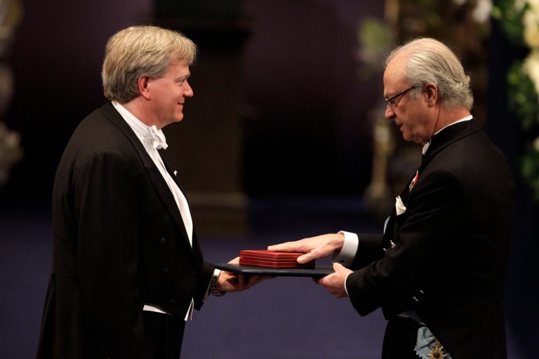 The 2011 Nobel Prize Laureate for Physics Dr Brian P. Schmidt from Australia receives his Nobel Prize from Sweden's King Carl XVI Gustaf, right, during the Nobel Prize award ceremony at the Stockholm Concert Hall in Stockholm, December 2011. (AP Photo/Matt Dunham)