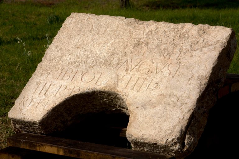 A commemorative inscription dedicated to the Emperor Hadrian that was found outside Jerusalem's Old City, is on display at the Rockefeller museum in Jerusalem, Tuesday, Oct. 21, 2014. Israeli archaeologists said Tuesday they have discovered a large stone with Latin engravings that lends credence to the theory that the reason Jews revolted against Roman rule nearly 2,000 ago was because of their harsh treatment. Israel's Antiquities Authority said the stone bears the name of the Roman emperor Hadrian and the year of his visit to Jerusalem, a few years before the failed Bar Kochba revolt in the second century A.D.  (AP Photo/Sebastian Scheiner)