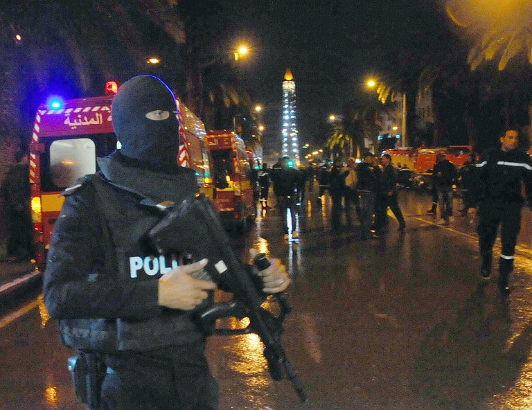 Vehicle carrying the president's security team explodes, killing 12 and injuring 16. (AP Photo/Hassene Dridi)