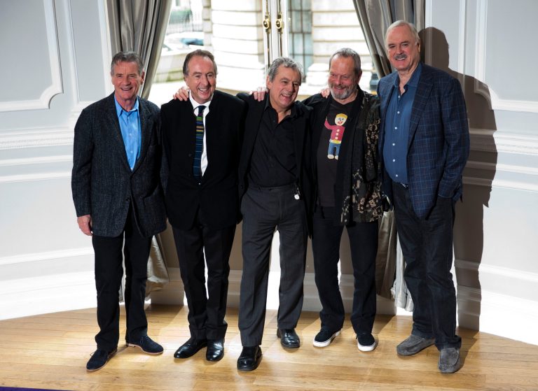 FILE - In this Thursday, Nov. 21, 2013, file photo the surviving members of the Monty Python comedy group, from left, Michael Palin, Eric Idle, Terry Jones, Terry Gilliam and John Cleese pose for photographers during a photocall to promote a reunion stage show they are going to perform together, at a hotel in London. American Monty Python fans who can't attend the troupe's London reunion can always look on the bright side of life. The show will be screened in hundreds of U.S. movie theaters. The anarchic British comedians are reuniting for 10 shows at London's O2 Arena in July, 34 years after their last stage performance. (AP Photo/Matt Dunham, File)