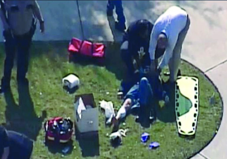 In this frame grab provided by KPRC Houston, an unidentified person is attended to by emergency personnel at Lone Star College Tuesday, Jan. 22, 2013, in Houston, where law enforcement officials say the community college is on lockdown amid reports of a shooter on campus. (AP Photo/Courtesy KPRC TV) MANDATORY CREDIT