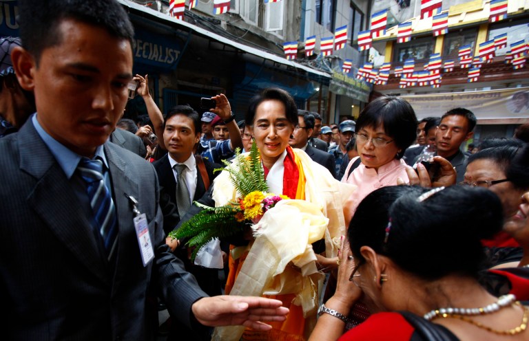 Nepalese people welcome Myanmar opposition leader Aung San Suu KyiÂ as she arrives at Sigal Monastery in Katmandu, Nepal, Monday, June 16, 2014. Suu Kyi arrived in Nepal Friday to attend a democracy conference, meet top political leaders and visit Buddhist pilgrimage sites. (AP Photo/Niranjan Shrestha)
