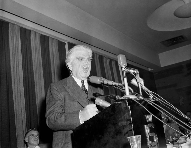 John L. Lewis, president of the United Mine Workers Union, discusses the coal industry's current economic plight in a speech before governors of coal-producing states in 1956. (AP/Byron Rollins)
