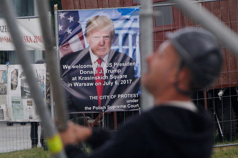 Workers build a podium that President Donald Trump will speak from durin a visit to Poland this week in Krasinski Square in Warsaw, Poland, Monday, July 3, 2017. Trump will be in Warsaw before traveling to Germany for a G20 summit of top world leaders. (AP Photo/Czarek Sokolowski)