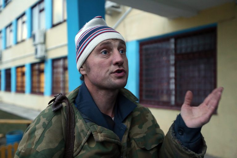   In this Monday, Dec. 3, 2012 photo Vladimir Dodonov, 37, speaks in the town of Borisov, 70 km (44 miles) east of Minsk, Belarus. Vladimir Dodonov wants to flee Belarus for neighboring Russia before it becomes illegal to leave his job at a wood-processing plant, whose surrounding high walls are topped with barbed wire. Belarus' authoritarian president, Alexander Lukashenko, has decided to stem an exodus of qualified workers to Russia, starting by banning those who work in wood-processing industries from quitting. Critics have compared the measure to serfdom and warned that it would only deepen the former Soviet republic's economic troubles and fuel protests against Lukashenko. (AP Photo/Sergei Grits)  