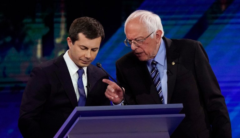 Democratic presidential candidates South Bend Mayor Pete Buttigieg, left and Sen. Bernie Sanders, I-Vt., talk during a break Thursday, Sept. 12, 2019, during a Democratic presidential primary debate hosted by ABC at Texas Southern University in Houston.