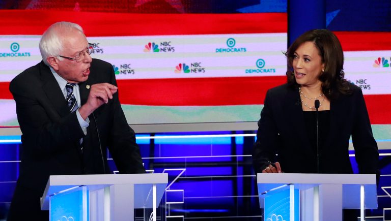 Democratic presidential candidate Sen. Bernie Sanders, I-Vt., gestures towards Sen. Kamala Harris, D-Calif., during the Democratic primary debate hosted by NBC News at the Adrienne Arsht Center for the Performing Art, Thursday, June 27, 2019, in Miami. 