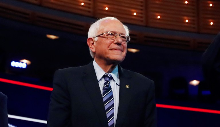 Democratic presidential candidates from left, South Bend Mayor Pete Buttigieg, former vice president Joe Biden, Sen. Bernie Sanders, I-Vt., and Sen. Kamala Harris, D-Calif., gesture before the start of the Democratic primary debate hosted by NBC News at the Adrienne Arsht Center for the Performing Arts, Thursday, June 27, 2019, in Miami.