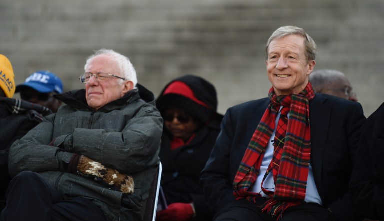 Democratic presidential hopefuls Bernie Sanders and Tom Steyer sit at the beginning of a Martin Luther King Jr. Day rally on Monday, Jan. 20, 2020, in Columbia, S.C.