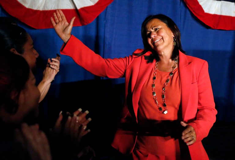   FILE - In the Sept. 10, 2013, file photo Democratic state Sen. Angela Giron waves to supporters as she gives her concession speech after she lost in a recall vote in Pueblo, Colo. Giron is one of two Colorado state lawmakers, who helped enact stricter firearms laws in the aftermath of the mass shootings in Colorado and Connecticut last year, to have been been ousted in National Rifle Association-aided recall elections. (AP Photo/Brennan Linsley, File)  