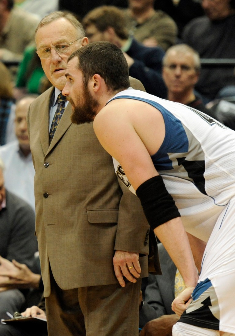   Minnesota Timberwolves head coach Rick Adelman, left, looks at Kevin Love during the third quarter of an NBA basketball game against the Denver Nuggets at the Target Center, Wednesday, Dec. 12, 2012, in Minneapolis. The Timberwolves won 108-105. (AP Photo/Hannah Foslien)  