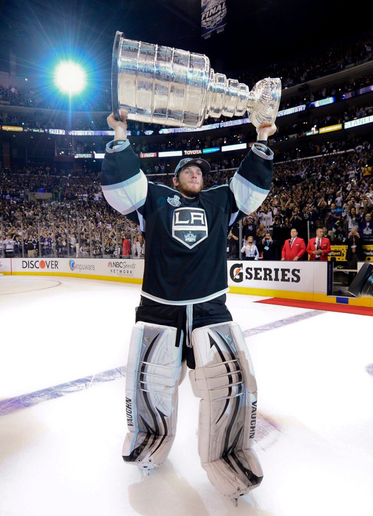   Los Angeles Kings goalie Jonathan Quick holds up the Stanley Cup after the Kings beat the New Jersey Devils 6-1during Game 6 of the NHL hockey Stanley Cup finals, Monday, June 11, 2012, in Los Angeles. (AP Photo/Mark J. Terrill)  