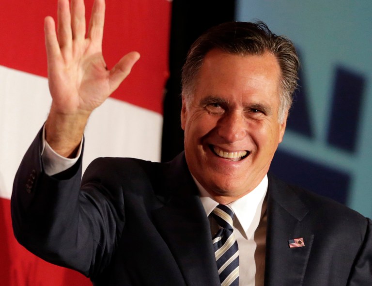 Former Republican presidential contender Mitt Romney walks on stage during an event celebrating the 52nd birthday of New Jersey Gov. Chris Christie, Wednesday, Sept. 10, 2014, in East Brunkswick, N.J. (AP Photo/Julio Cortez)