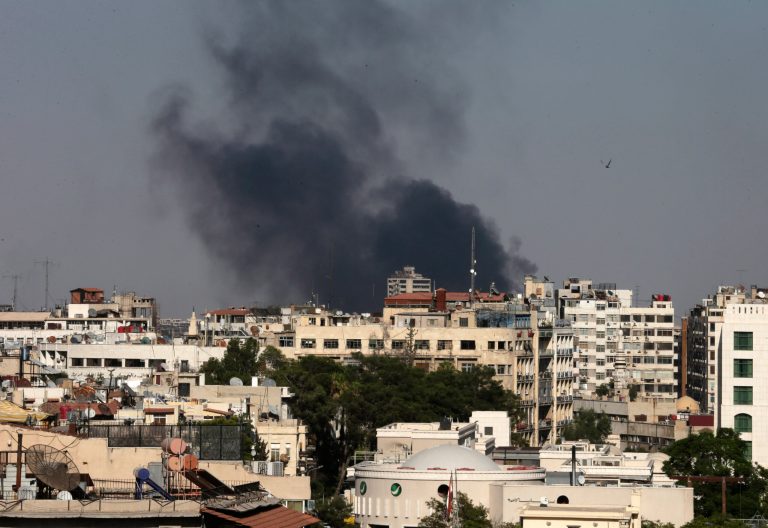 Black columns of smoke rise from heavy shelling in the Jobar neighborhood, east of Damascus, Syria. (AP/Hassan Ammar)
