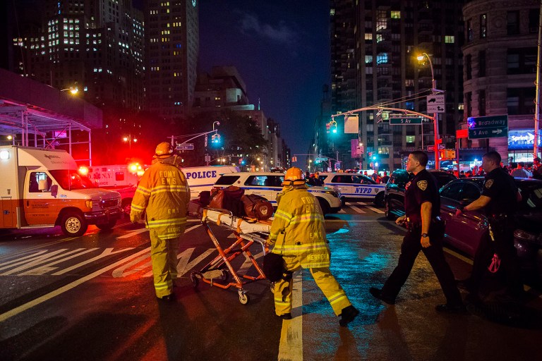Police and firefighters work near the scene of an apparent explosion in Manhattan's Chelsea neighborhood, in New York, Saturday, Sept. 17, 2016. (AP Photo/Andres Kudacki)