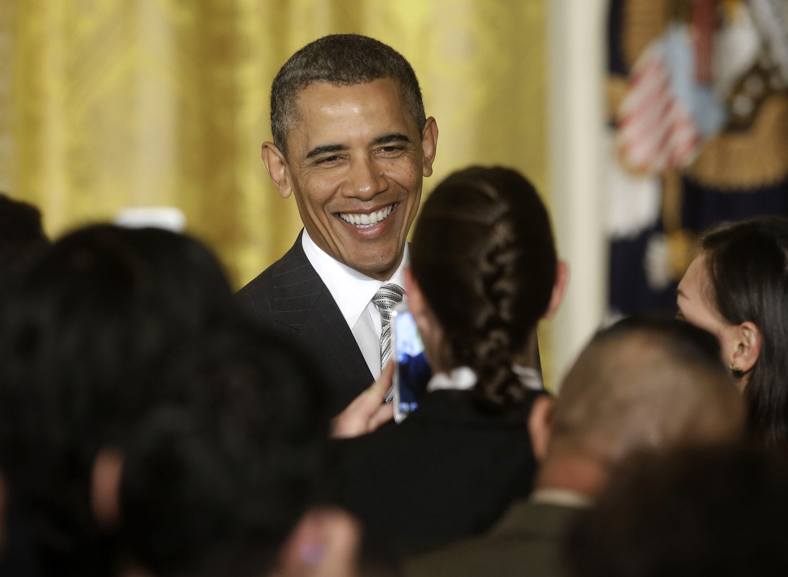 Obama calls for April debate on immigration bill