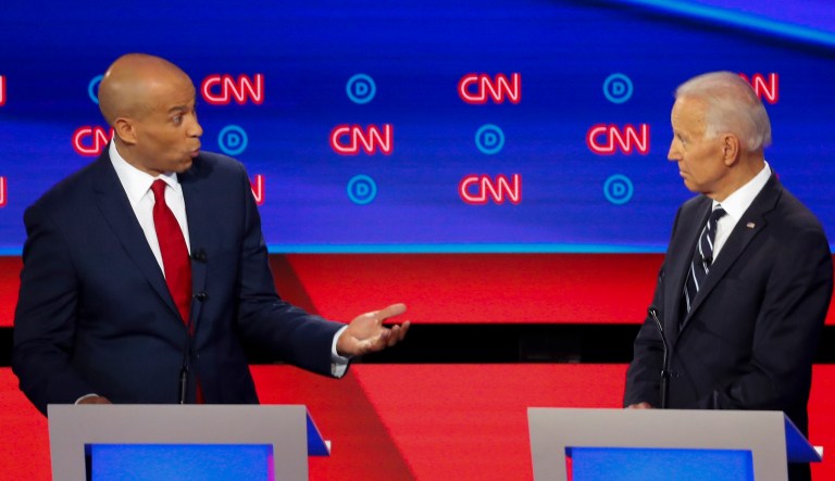 Sen. Cory Booker, D-N.J., speaks to former Vice President Joe Biden as they participate in the second of two Democratic presidential primary debates hosted by CNN Wednesday, July 31, 2019, in the Fox Theatre in Detroit.