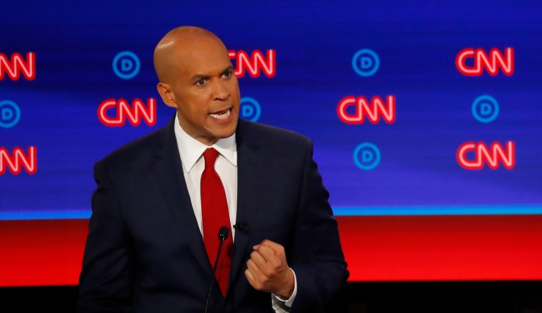 Sen. Cory Booker, D-N.J., speaks as former Vice President Joe Biden listens during the second of two Democratic presidential primary debates hosted by CNN Wednesday, July 31, 2019, in the Fox Theatre in Detroit.