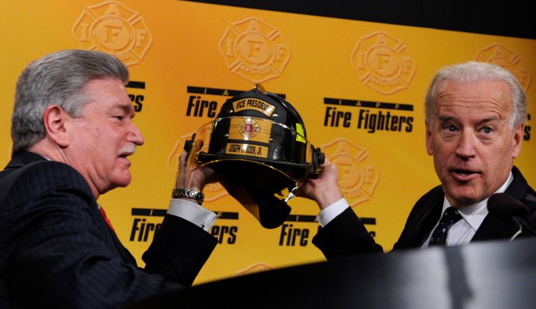 International Association of Fire Fighters General President Harold A. Schaitberger, left, and Vice President Joe Biden hold up a helmet that he was presented with after his remarks at the International Association of Fire Fighters 2009 Legislative Conference in Washington, Monday, March 16, 2009. 