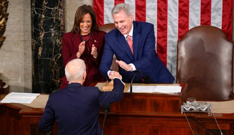 President Joe Biden shakes hands with House Speaker Kevin McCarthy of Calif., as he arrives to deliver the State of the Union address to a joint session of Congress at the U.S. Capitol, Tuesday, Feb. 7, 2023, in Washington. Vice President Kamala Harris applauds at left.