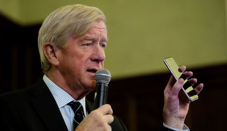 Republican presidential candidate and former Massachusetts Gov. Bill Weld talks about using a mobile phone to vote while addressing students and guests during a campaign stop Wednesday, Oct. 16, 2019, at Tufts University in Medford, Mass.
