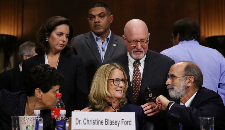 Christine Blasey Ford and her attorneys Debra Katz, foreground left, and Michael Bromwich, foreground right, take a break during testimony before the Senate Judiciary Committee, Thursday, Sept. 27, 2018 in Washington.