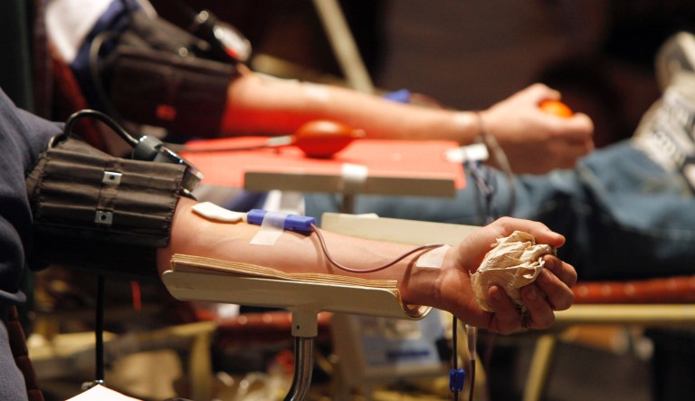 Donors give blood at a record attempt for blood donations in Rutland, Vt., Tuesday, Dec. 20, 2011. Organizers of Vermont's Gift of Life blood drive marathon are hoping almost 2,000 people show up in Rutland to set a nationwide, single-day blood drive record.To set the record, 1,969 pints of blood will have to be collected.