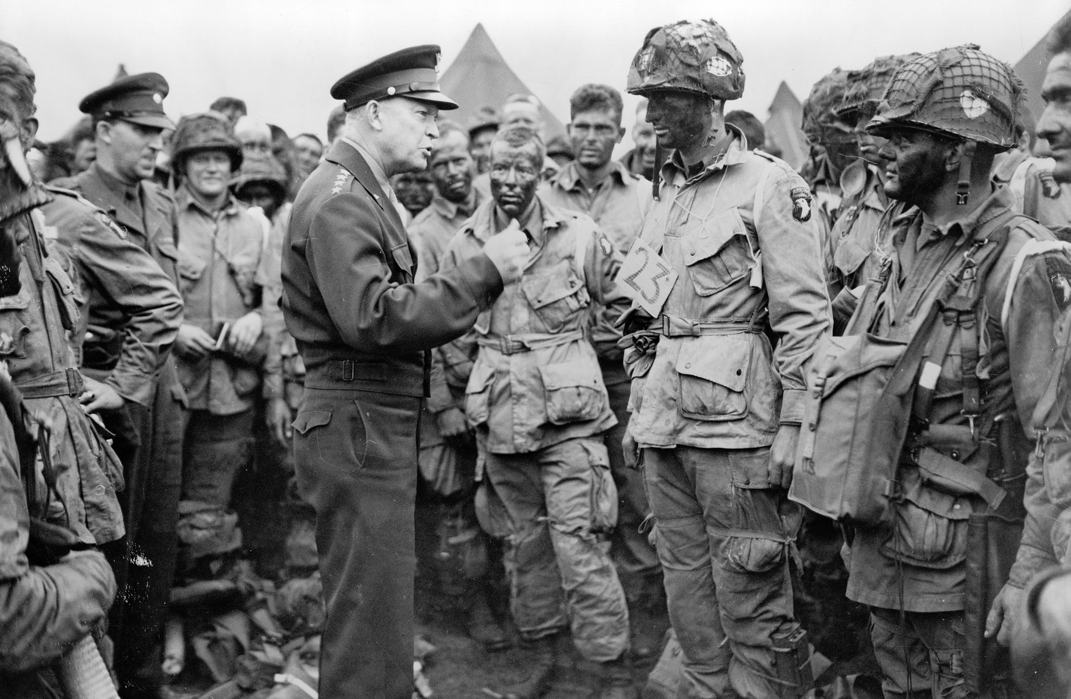 Supreme Allied Commander Gen. Dwight D. Eisenhower gives the order of the day—"Full victory—nothing else"—to paratroopers in England just before they board their invasion airplanes for the D-Day invasion.