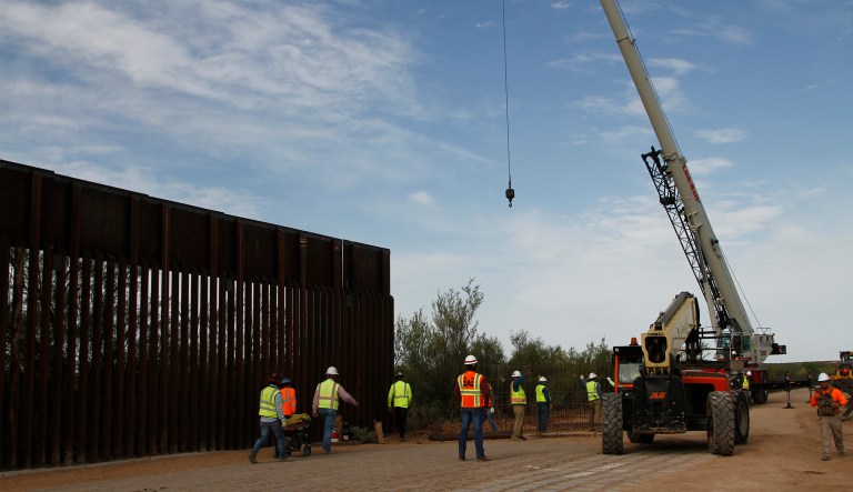 Workers break ground on new border wall construction about 20 miles west of Santa Teresa, New Mexico, Aug. 23, 2019.