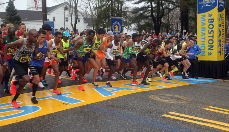 FILE - In this April 15, 2019, file photo, the elite men break from the start of the 123rd Boston Marathon in Hopkinton, Mass. The 2020 Boston Marathon, which was rescheduled to run on Sept. 14th, was canceled Thursday May 28, 2020 for the first time in its 124-year history due to the COVID-19 virus outbreak.