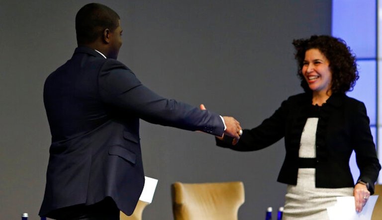 IMAGE DISTRIBUTED FOR JPMORGAN CHASE & CO. -  Gerald Owusu, Associate, JPMorgan Chase and The Fellowship Initiative (TFI) Alumni, left, hands the stage over to Janis Bowdler, President of the JPMorgan Chase Foundation at JPMorgan Chase Future of Work event on Monday, March 18, 2019 in New York. 