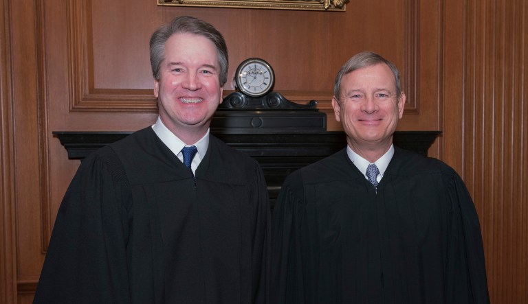 This image provided by the U.S. Supreme Court show Associate Justice Brett M. Kavanaugh, left and Chief Justice John G. Roberts, Jr. in the Justices' Conference Room before a investiture ceremony Thursday, Nov. 8, 2018, at the Supreme Court in Washington.