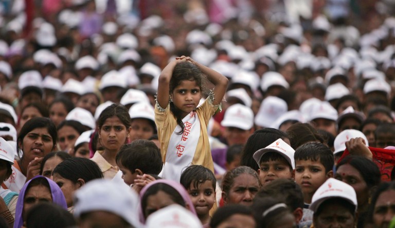 FILE- In this March 5, 2006 file photo, a girl amongst the audience looks on during an event against female feticide organized by Delhi Commission for Women, in New Delhi, India.