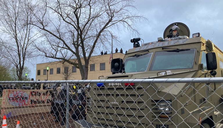 Minnesota police guard the Brooklyn Center police department.