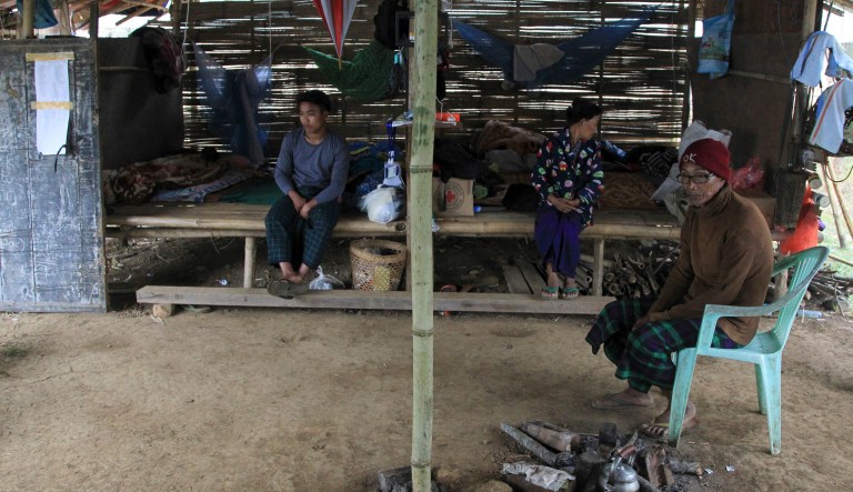 In this May 6, 2018, photo, internally displaced ethnic Kachins rest at their hut in compound of Trinity Baptist Church refugee camp in Myitkyina, Kachin State, northern Myanmar. Myanmar's army, notorious for perpetrating violence that drove 700,000 Muslim ethnic Rohingyas to flee to neighboring Bangladesh, now stands accused of fostering a similar humanitarian crisis in the country's north, where it battles guerrillas of the Christian Kachin minority.