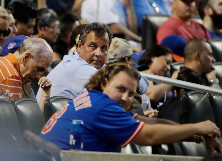 New Jersey Gov. Chris Christie watches during the fourth inning of a baseball game between the New York Mets and the St. Louis Cardinals on Tuesday, July 18, 2017, in New York. (AP Photo/Frank Franklin II)