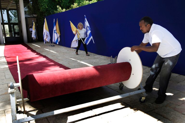 Workers at the Israeli president's residence make preparations ahead of the Papal visit to Jerusalem, Thursday, May 22, 2014. Pope Francis will visit the region for three days starting Saturday. (AP Photo/Tsafrir Abayov)
