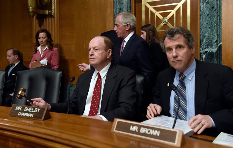 Senate Banking Committee Chairman Sen. Richard Shelby, R-Ala., left, sitting next to the committee's ranking member Sen. Sherrod Brown, D-Ohio, uses his gavel to begin a hearing on Capitol Hill in Washington, Tuesday, Jan. 27, 2015, on Iran sanctions. (AP Photo/Susan Walsh)
