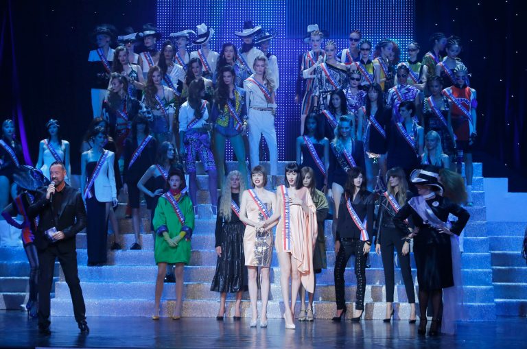 Models perform on stage  with as part of French  designer Jean Paul Gaultier's final Spring/Summer 2015 ready-to-wear fashion collection, presented in Paris, France, Saturday, Sept. 27, 2014.  (AP Photo/Jacques Brinon)