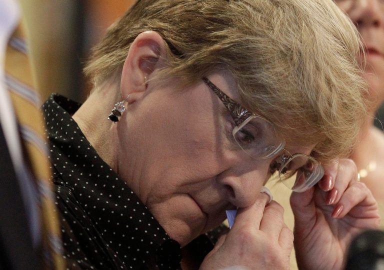   Nanci Koschman, mother of David Koschman wipes away a tear during a news conference, Monday, Dec. 3, 2012, in Chicago, where Koschman and supporting attorneys responded to the news that the nephew of former Chicago Mayor Richard Daley was indicted for involuntary manslaughter in the 2004 death of 21-year-old Koschman outside a Chicago bar. A grand jury is continuing its inquiry into how authorities handled the initial investigation and whether there was a cover-up. Richard Vanecko was indicted by a Cook County special grand jury in the death of David Koschman. Koschman died days after he fell and struck his head during a fight with Vanecko outside a bar in Chicago's Gold Coast neighborhood. (AP Photo/M. Spencer Green)  