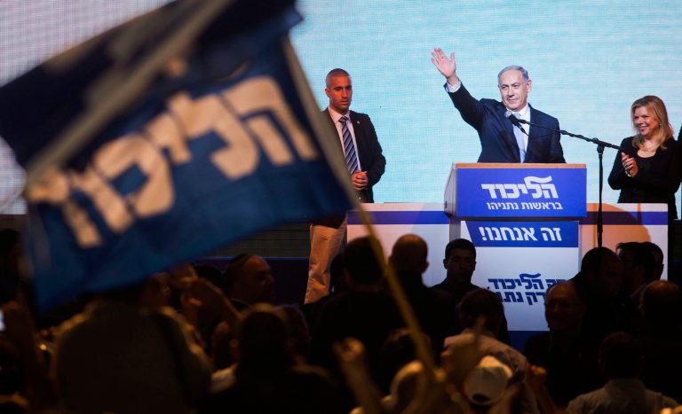 Israeli Prime Minister Benjamin Netanyahu greets supporters at the party's election headquarters in Tel Aviv. Wednesday, March 18, 2015. Netanyahu's ruling Likud Party scored a resounding victory in the country's election, final results showed Wednesday, a stunning turnaround after a tight race that had put his lengthy rule in jeopardy.(AP Photo/Dan Balilty)