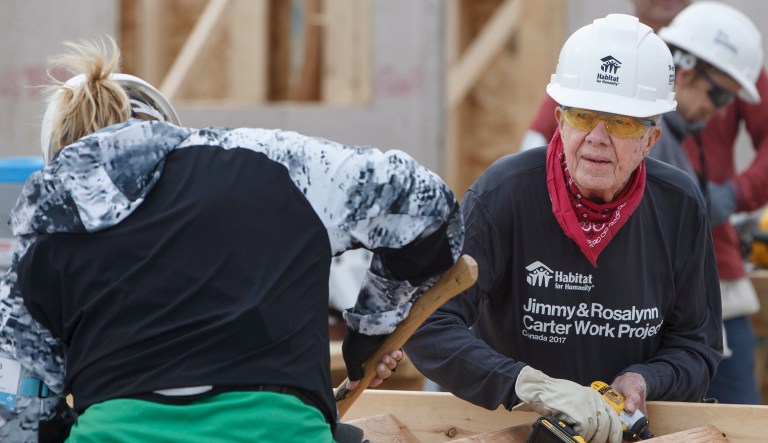 Former President Jimmy Carter has been released from a hospital in Canada after being treated for dehydration. Carter was working with Habitat for Humanity, building a home in Winnipeg. (Jason Franson/The Canadian Press via AP)