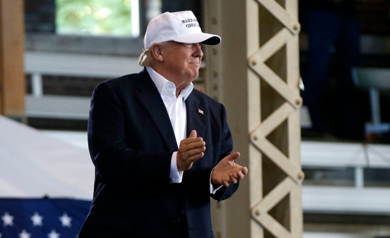 Donald Trump maintains a lead over Hillary Clinton in the battleground state of Iowa, according to a new poll that was conducted before the audio leak of Trump making lewd comments about women in 2005. (AP Photo/Gerald Herbert)